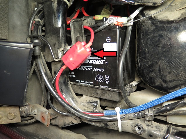 Circuit breaker adjacent to battery.